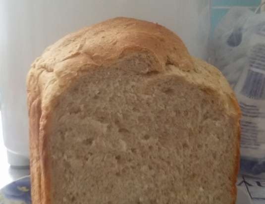 Gray bread on light beer in a bread maker