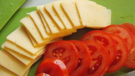 Eggplant baked in the oven with cheese and tomatoes in a different manner