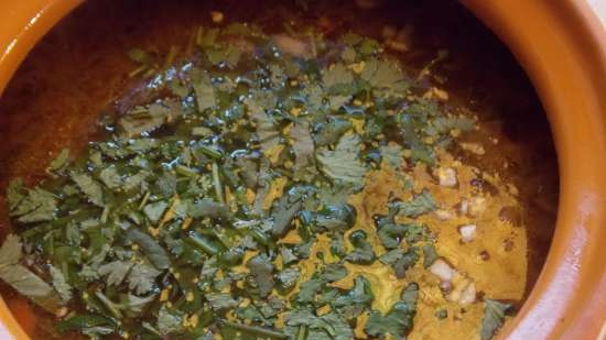 Lean cabbage soup with cabbage, beans, mushrooms and prunes under a bread lid