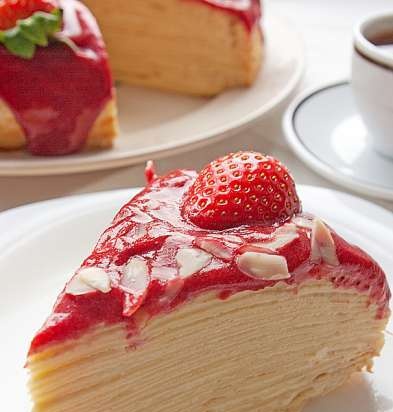 Pancake cake with custard, mascarpone and berry sauce