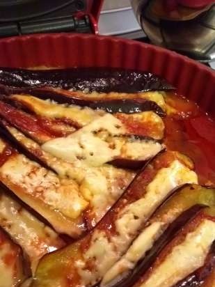 Eggplant baked in the oven with cheese and tomatoes in a different manner