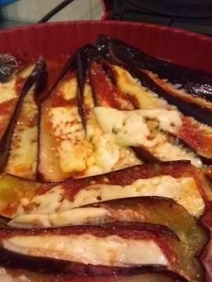 Eggplant baked in the oven with cheese and tomatoes in a different manner