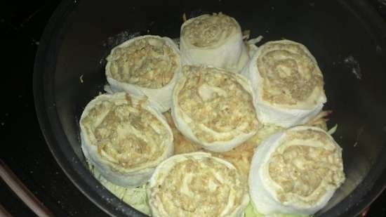 Rolls with minced meat on a vegetable pillow in a slow cooker