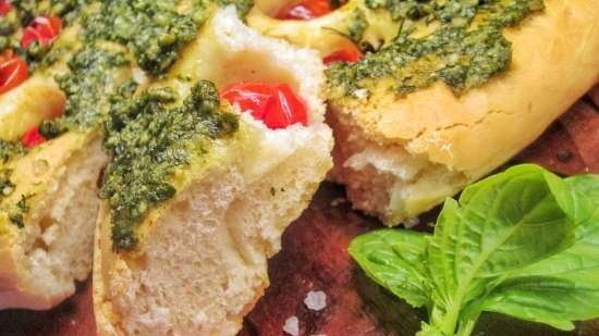 Focaccia with pesto sauce and cherry tomatoes