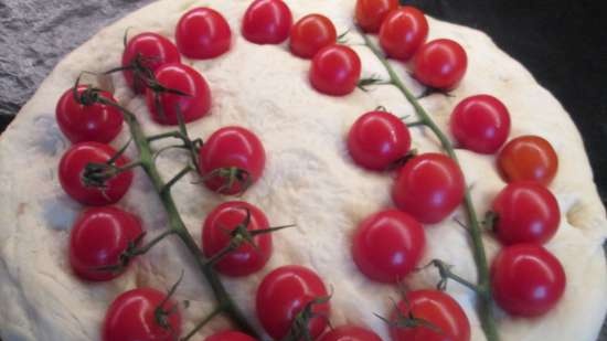 Focaccia with pesto sauce and cherry tomatoes