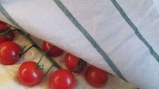 Focaccia with pesto sauce and cherry tomatoes