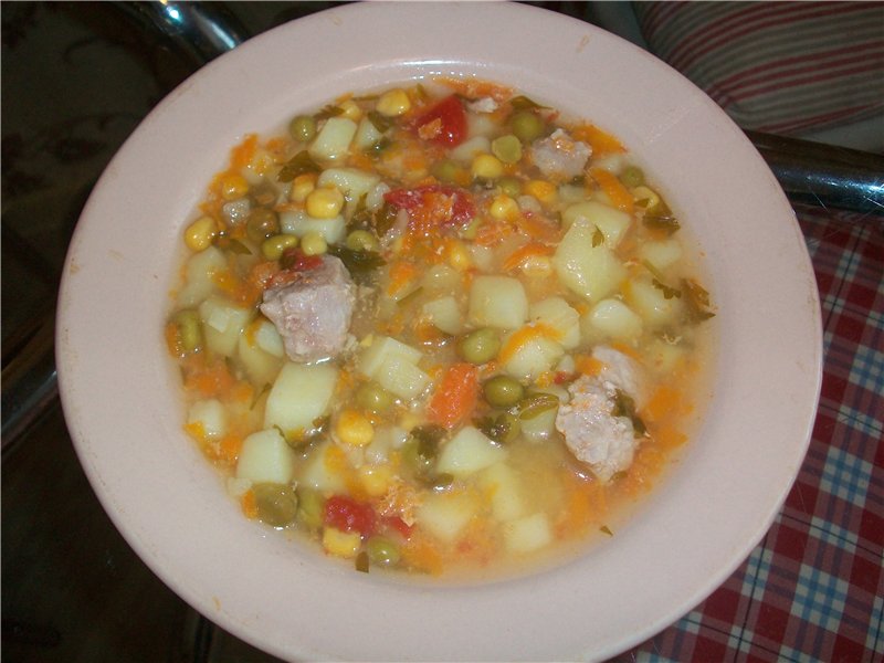 Thick soup with corn, peas and pumpkin